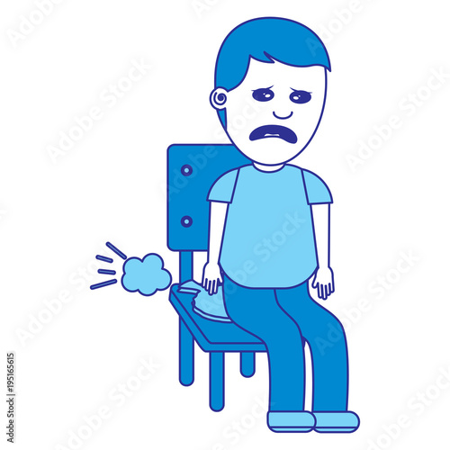 Foto sad man sitting in chair with whoopee cushion fools day