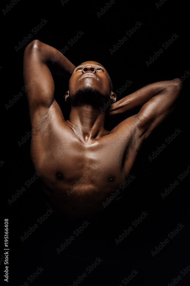 portrait of African-American man on black background