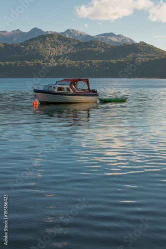 Boat on the Nahuel Huapi Lake in Patagonia with the Andes Mountains in the background