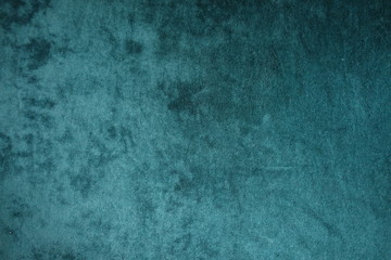 Dark green velvet fabric surface from above