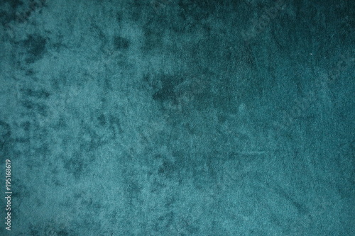 Dark green velvet fabric surface from above photo