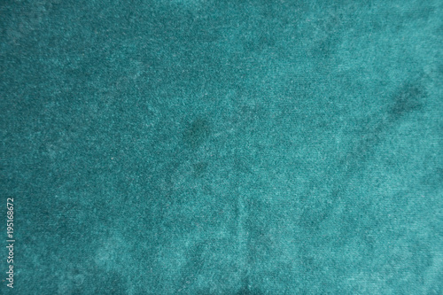 Surface of dark green napped fabric from above