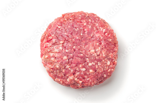 Closeup of some raw burgers on a white background