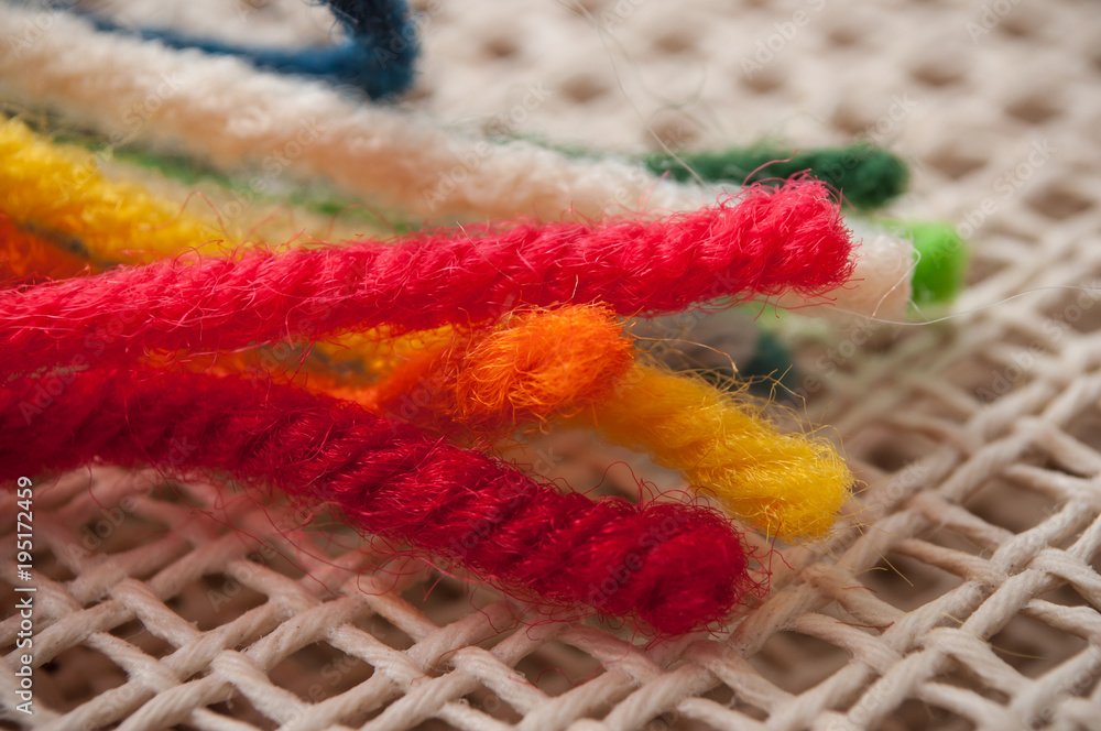 closeup of creative leisure with colorful wool wire on canvas