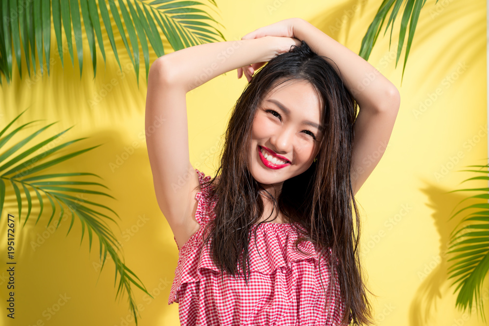 Fashion portrait of a young model with wet long hair. Perfect skin and make-up. Fashion portrait of a young model with wet long hair. Perfect skin and make-up.