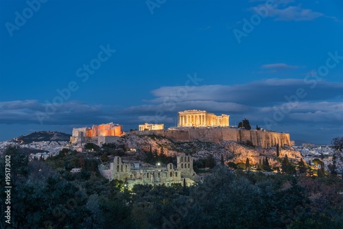 View of the Acropolis at dusk with lights on