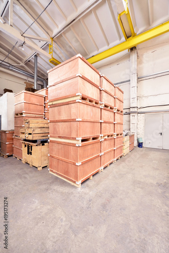 Large and light warehouse, cargo storage in wooden boxes © pridannikov