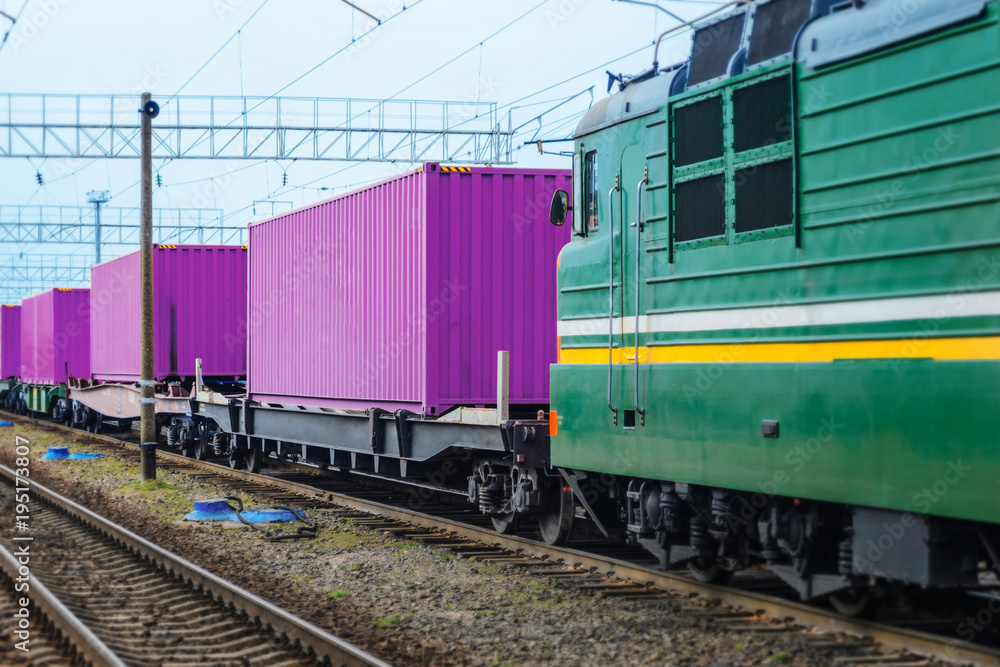 Transportation of cargoes by rail in containers. Railway infrastructure background Transportation of cargoes by rail in containers. Railway infrastructure background
