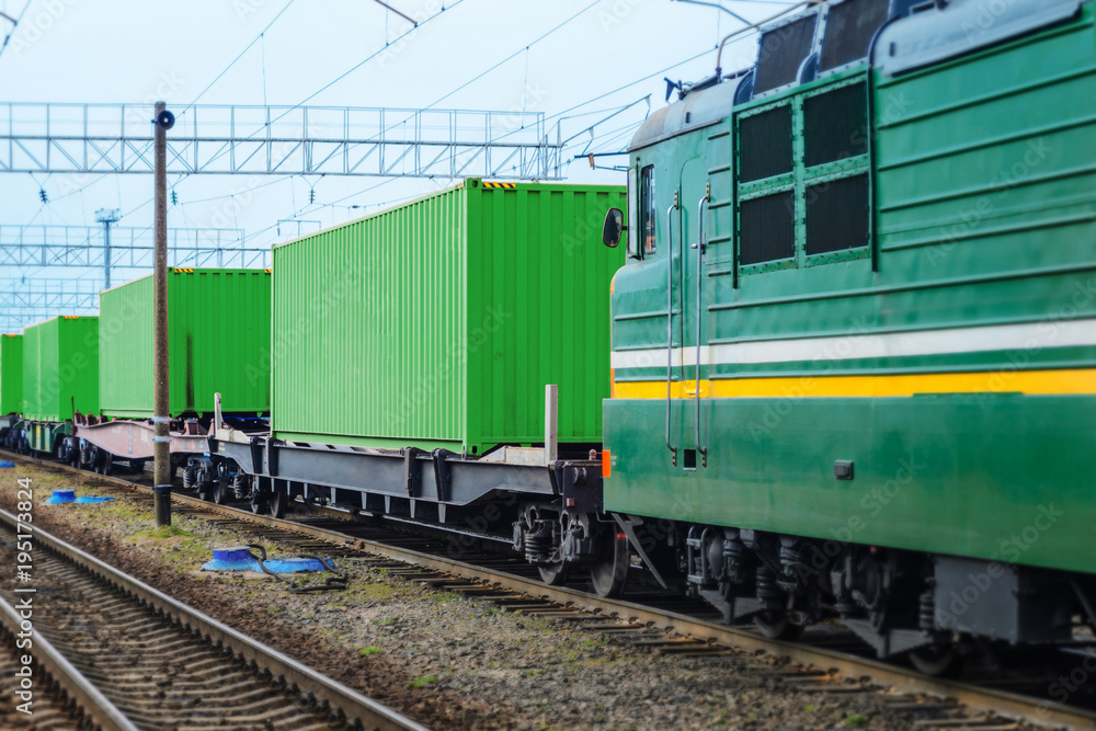 Transportation of cargoes by rail in containers. Railway infrastructure background Transportation of cargoes by rail in containers. Railway infrastructure background