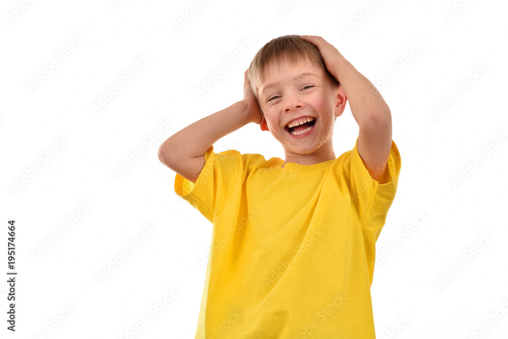 Cheerful child on a white background. Yellow T-shirt. Good mood. Cheerful child on a white background. Yellow T-shirt. Good mood.