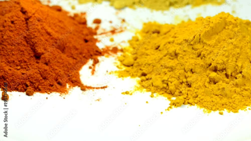 turmeric, chili, ginger, powder on turn table turmeric, chili, ginger, powder on turn table