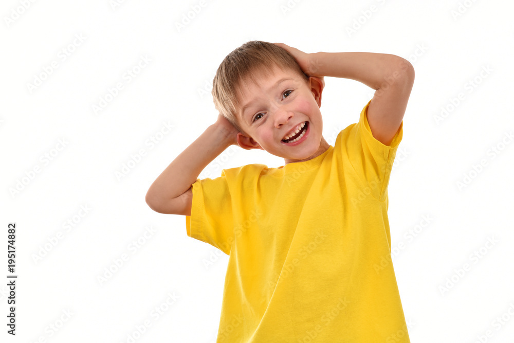 Cheerful child on a white background. Yellow T-shirt. Good mood. Cheerful child on a white background. Yellow T-shirt. Good mood.