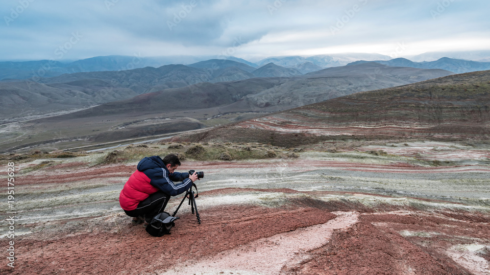 Nature photographer in red mountains