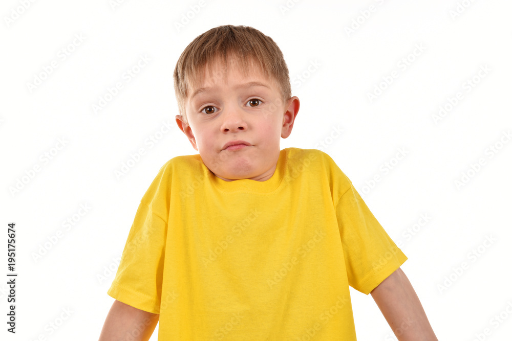 Cheerful child on a white background. Yellow T-shirt. Good mood. Cheerful child on a white background. Yellow T-shirt. Good mood.