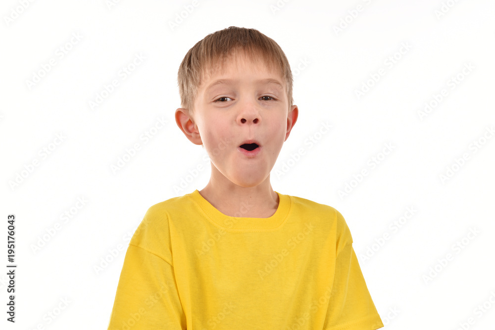 Cheerful child on a white background. Yellow T-shirt. Good mood. Cheerful child on a white background. Yellow T-shirt. Good mood.