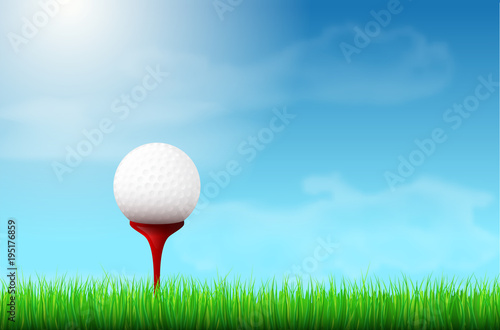 Golf ball on red tee, grass and blue sky