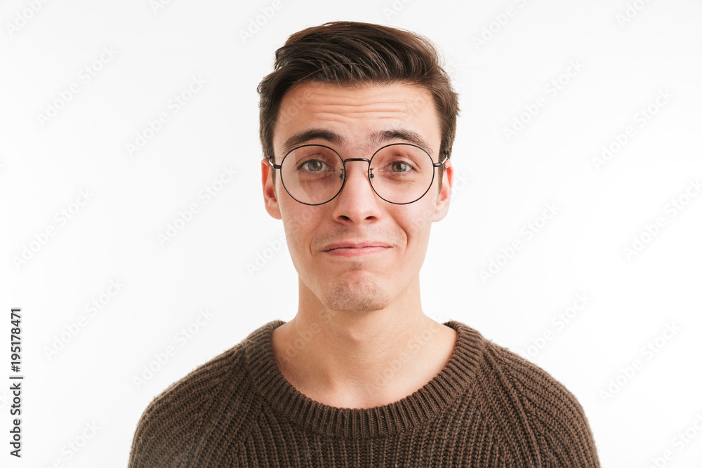 Close up portrait of a satisfied young man in sweater