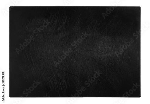 black and scratched chopping board, top view of the object on white background