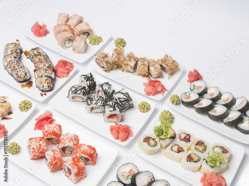 set of sushi rolls, on white background, top view