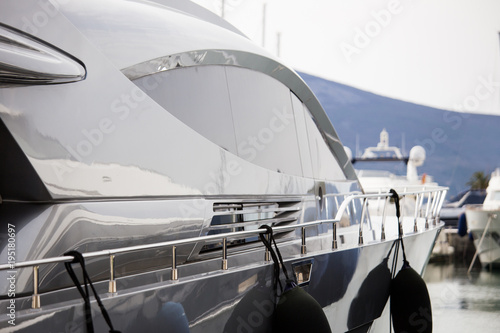 Luxury yachts moored to the pier in the marina