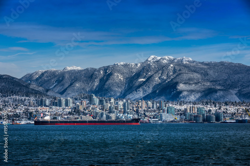 Tanker and Rocky Mountains, North Vancouver, British Colombia, Canada.