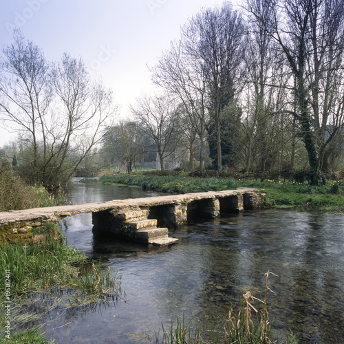 England, Cotswolds, Gloucestershire, Eastleach, River Leach, ancient clapper bridge photo