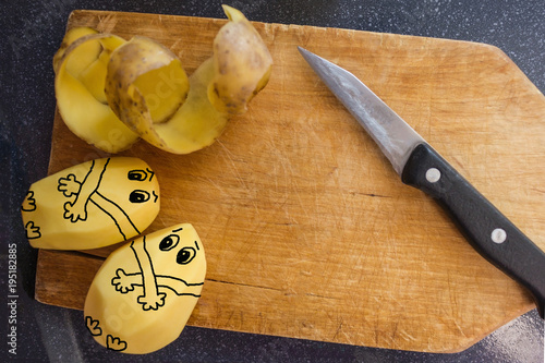 Cleaning of raw potatoes. photo