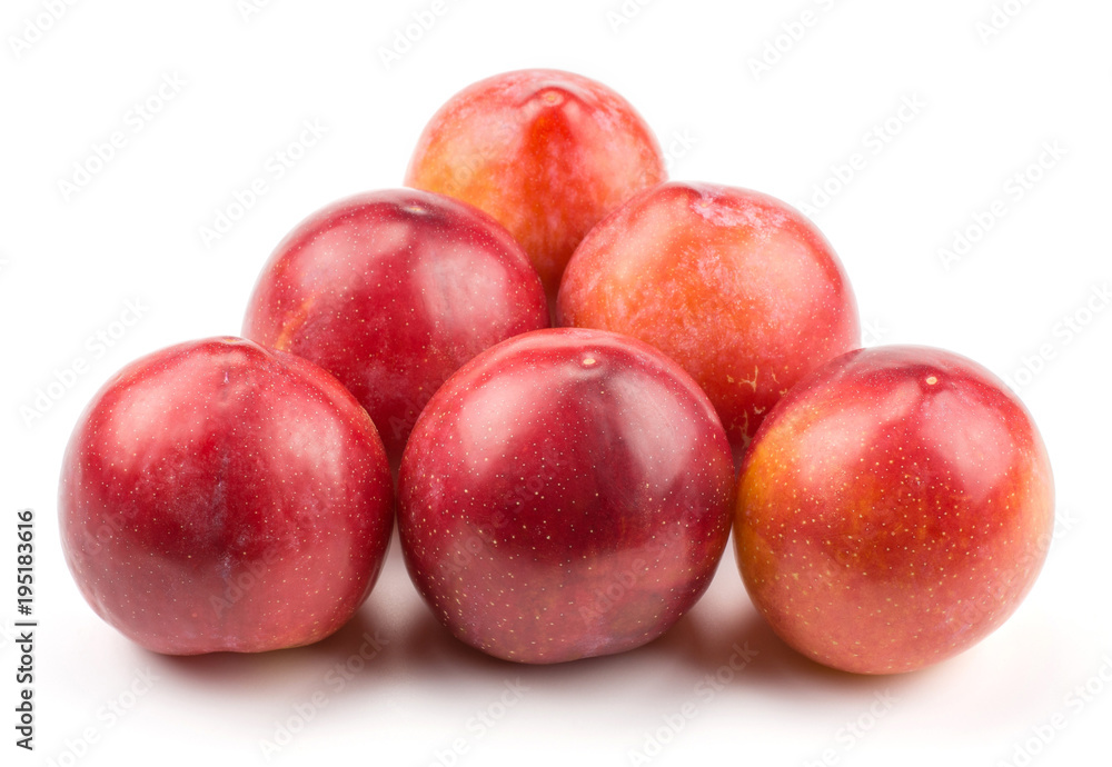 Six plums red orange isolated on white background like billiard balls triangle.