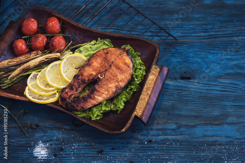 Grilled salmon steak with v...