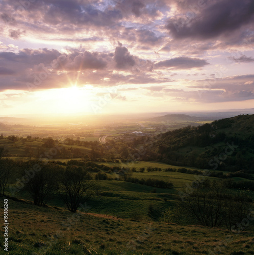 England, Cotswolds, Gloucestershire, sunset view from Birdlip Hill over the Severn Vale and Gloucester