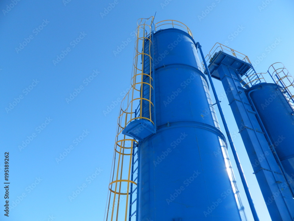  production tanks on a blue sky background