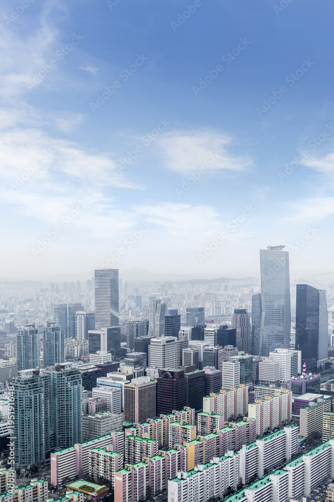 Fototapeta premium high rise office buildings in Seoul city, winter daylight wiht han river, Seoul, republe of Republic of Korea, in fog winter