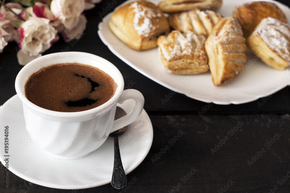 Cup of hot coffee and cookies for breakfast on wooden table Cup of hot coffee and cookies for breakfast on wooden table