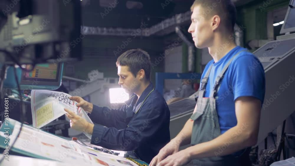 Workers at industrial factory working with computer touchscreen. Workers at industrial factory working with computer touchscreen.