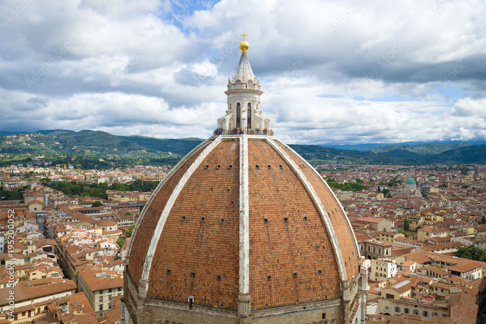 Dome of medieval Cathedral of Santa Maria del Fiore close up in the cloudy September afternoon. Florence, Italy