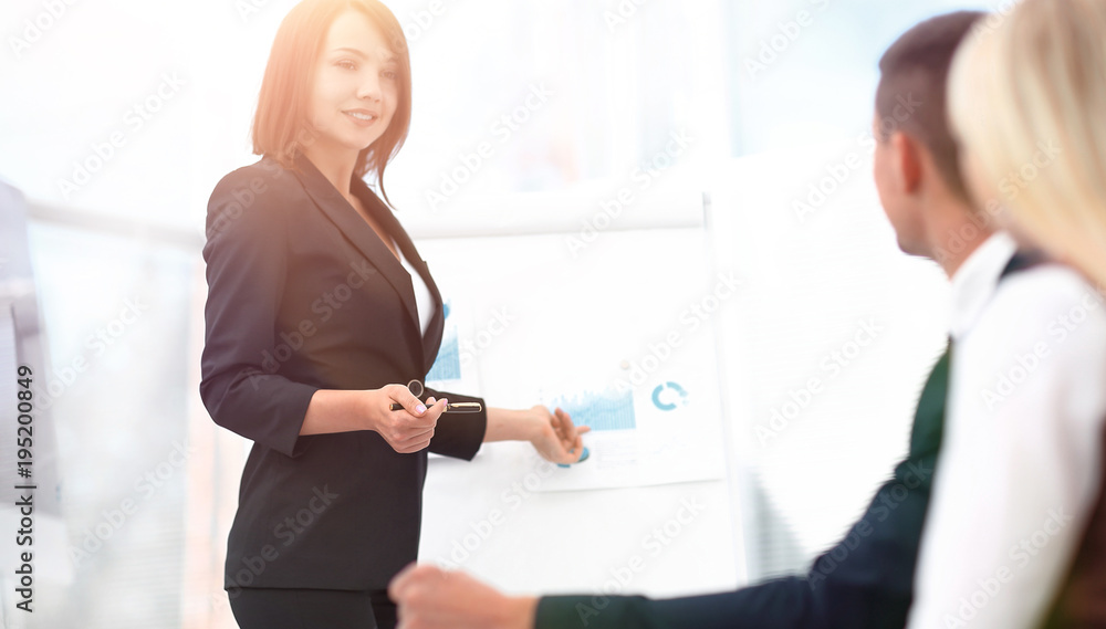 business woman conducts a workshop with the business team. business woman conducts a workshop with the business team.