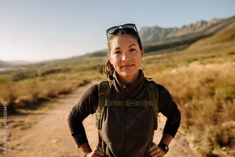 Young asian female hiker with backpack