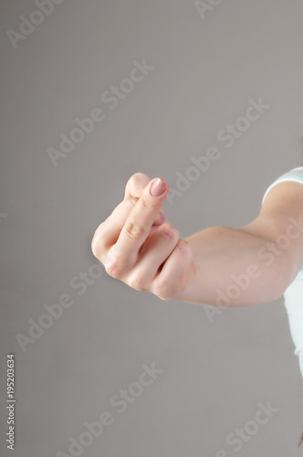Woman hand showing middle finger on a white isolated background