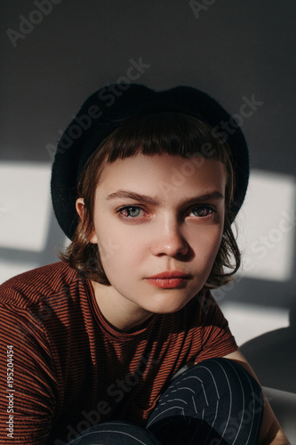 Surreal studio portrait of beautiful young woman with color lenses photo