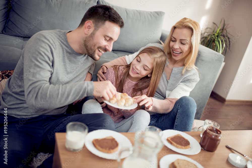 Happy family having breakfast together at home. Happy family having breakfast together at home.