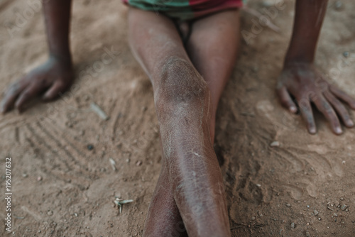Crop legs of ethnic child photo