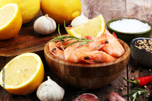 Raw fresh Prawns Langostino Austral. shrimp seafood with lemon and spices.