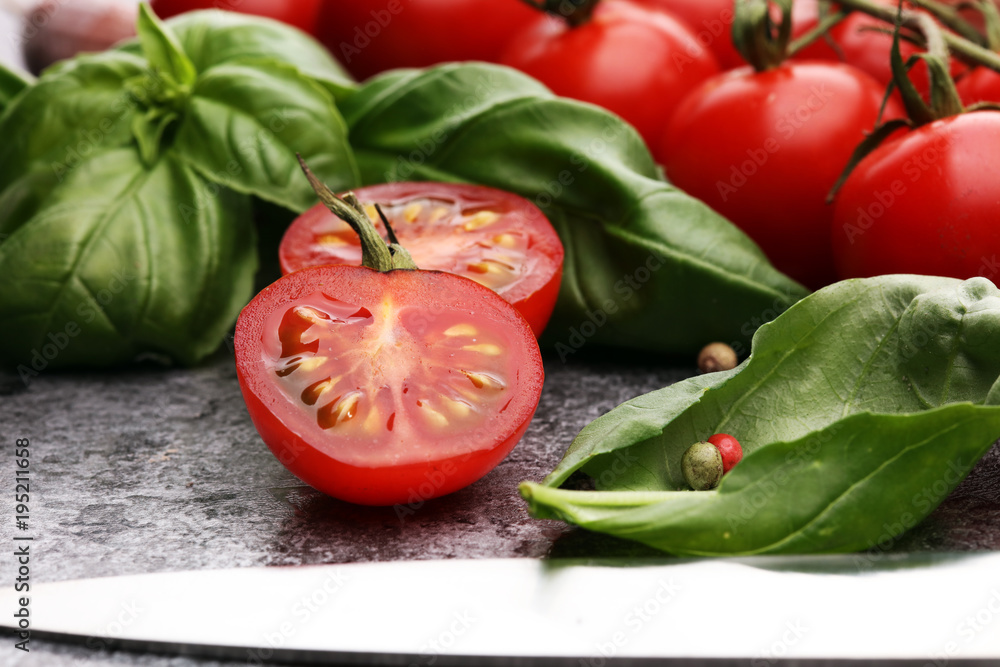 tomato and italian ingredient. Ripe tomatoes with fresh basil, garlic tomato and italian ingredient. Ripe tomatoes with fresh basil, garlic