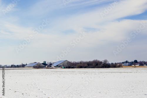 View over the fields to a large agricultural building