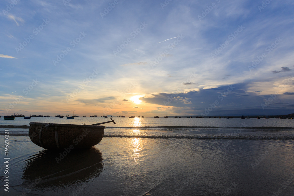 Vietnamese fishing boat silhouettes in sea at sunset Vietnamese fishing boat silhouettes in sea at sunset
