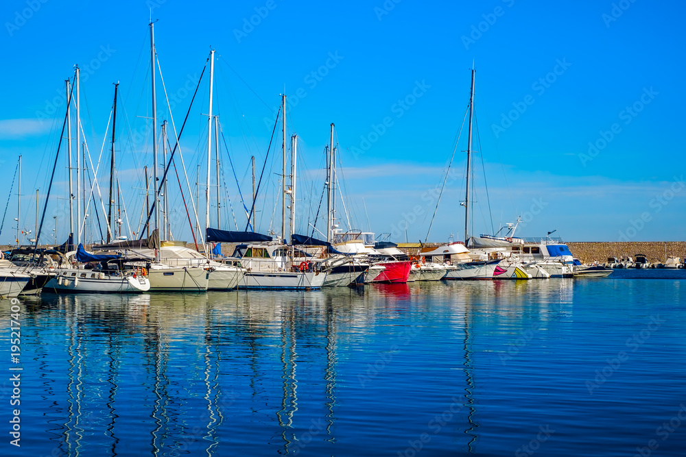 yachts docked in sea port