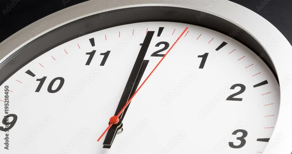 modern alarm clock is showing midday or midnight movement. It is twelve o'clock, holiday happy new year festive and christmas or lunch concept, time-lapse effect modern alarm clock is showing midday or midnight movement. It is twelve o'clock, holiday happy new year festive and christmas or lunch concept, time-lapse effect