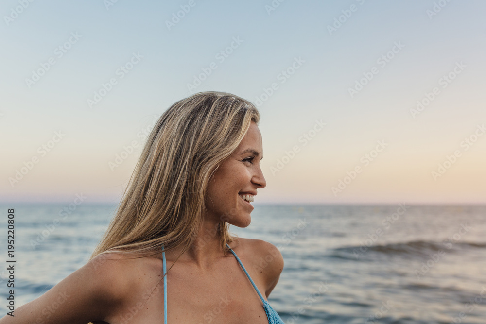 Portrait of a happy blonde girl at the beach Portrait of a happy blonde girl at the beach
