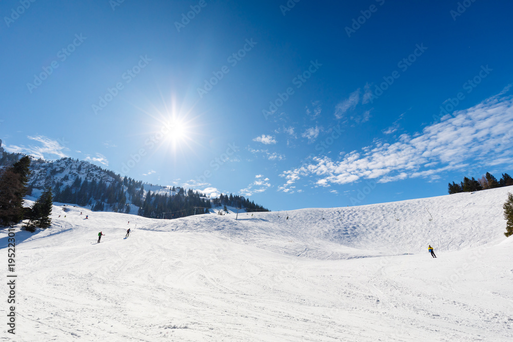 Ski slope on sunny winter day
