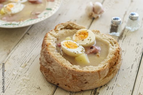 Traditional polish soup called Zurek served in small bread